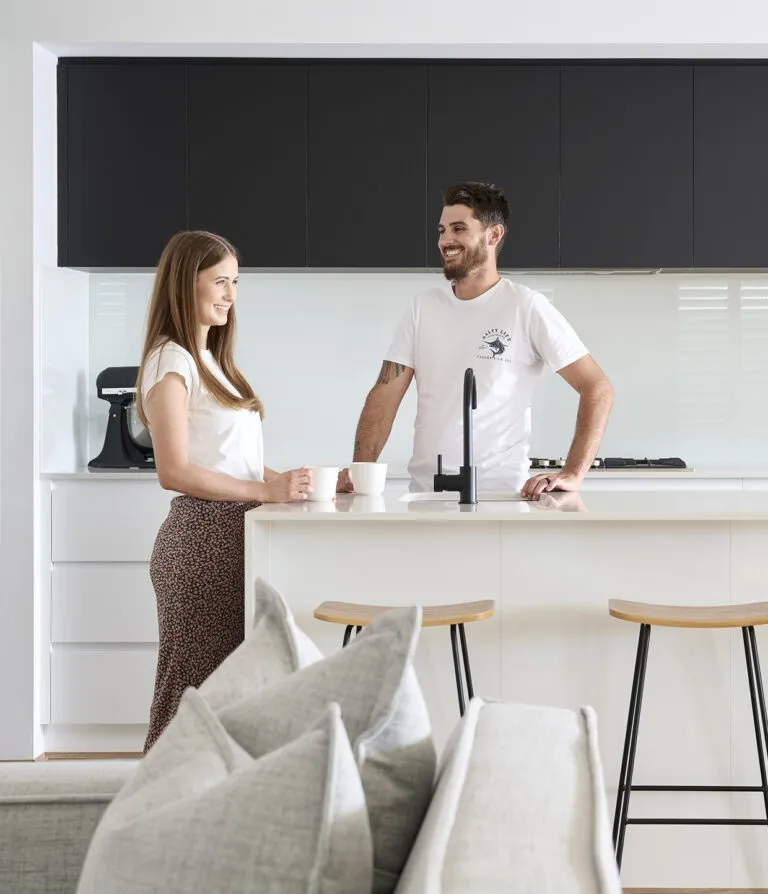 New Generation Homes Finance Assistance Perth couple in kitchen enjoying their new home